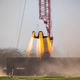 A SpaceX Crew Dragon capsule undergoing a hover test in 2015.